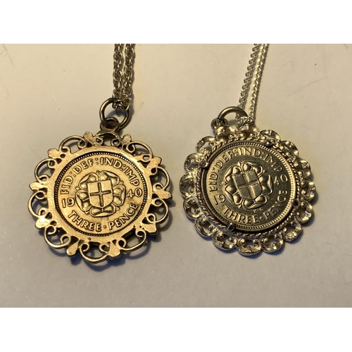 562 - TWO SILVER NECKLACES WITH COIN PENDANTS