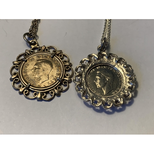 562 - TWO SILVER NECKLACES WITH COIN PENDANTS