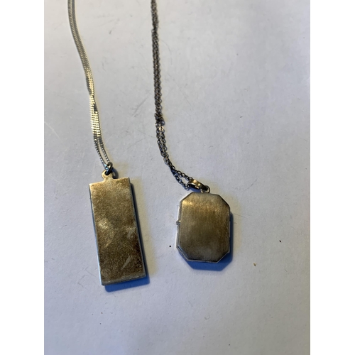 579 - TWO SILVER NECKLACES WITH PENDANTS