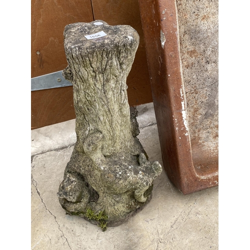 1656 - A RECONSTITUTED STONE PEDESTAL BASE WITH FOX DECORATION