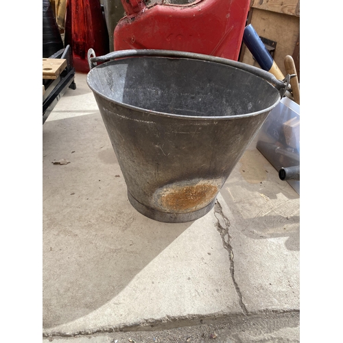 1670 - TWO VINTAGE PETROL JERRY CANS AND A GALVANISED BUCKET