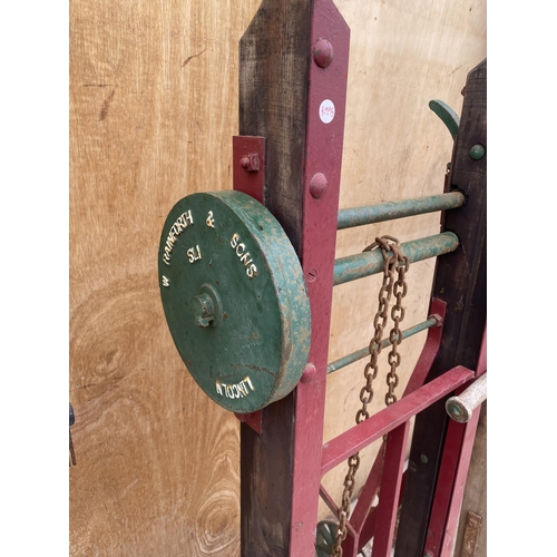 1558 - A VINTAGE WOODEN AND STEEL RAILWAY TROLLEY BEARING THE NAME 'W RAINFORTH'