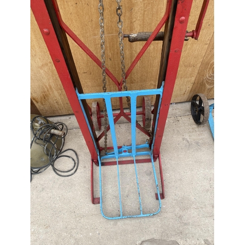 1560 - A VINTAGE WOODEN AND STEEL RAILWAY TROLLEY BEARING THE NAME 'G LEWIS & SONS LTD'