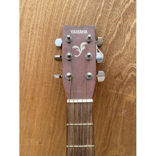 1561 - A YAMAHA F-310 ACOUSTIC GUITAR