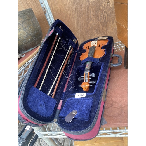 1580 - A VIOLIN IN CARRY CASE AND COMPLETE WITH A BOW