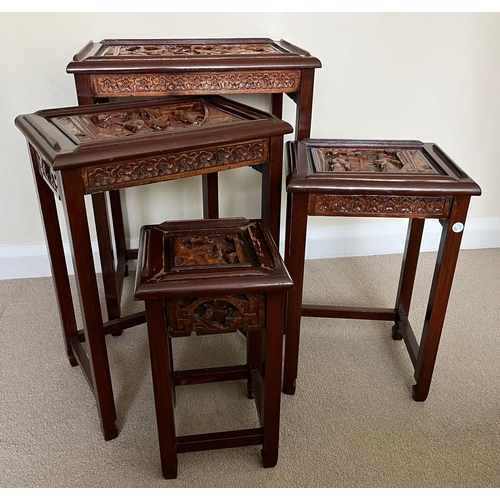 327 - A SET OF FOUR CHINESE CARVED HARDWOOD NEST OF TABLES, THE SMALLEST WITH SINGLE DRAWER