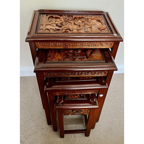 327 - A SET OF FOUR CHINESE CARVED HARDWOOD NEST OF TABLES, THE SMALLEST WITH SINGLE DRAWER