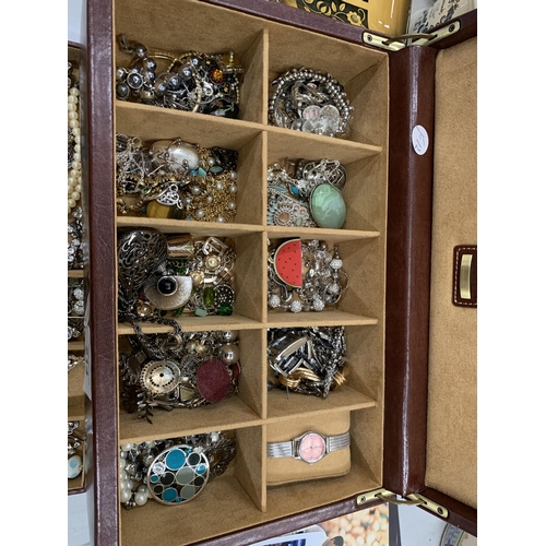 214 - A JEWELLERY BOX CONTAINING ASSORTED COSTUME JEWELLERY