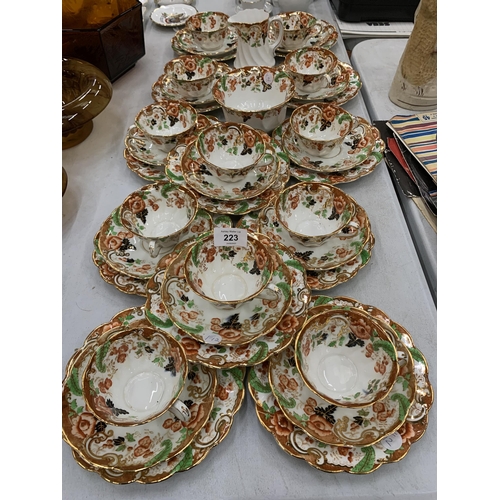 223 - A LARGE QUANTITY OF ROYAL WINDSOR CHINA CUPS, SAUCERS AND SIDE PLATES PLUS A CREAM JUG AND SUGAR BOW... 