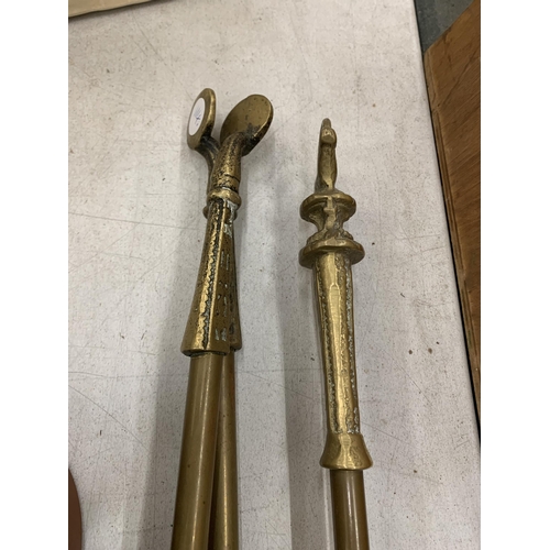 258 - A LARGE BRASS SHOVEL AND TONGS