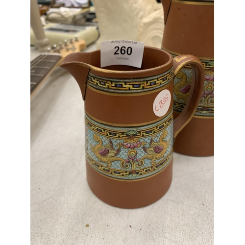 260 - TWO TERRACOTTA TYPE VASES WITH GRIFFIN DESIGN BANDING