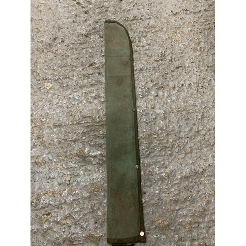 264 - A VINTAGE MILITARY MACHETE AND SCABBARD