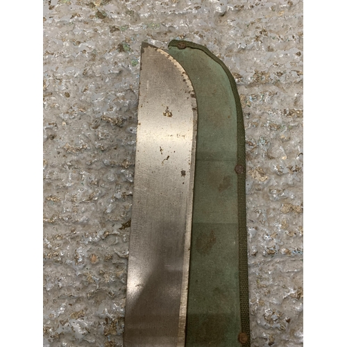 264 - A VINTAGE MILITARY MACHETE AND SCABBARD