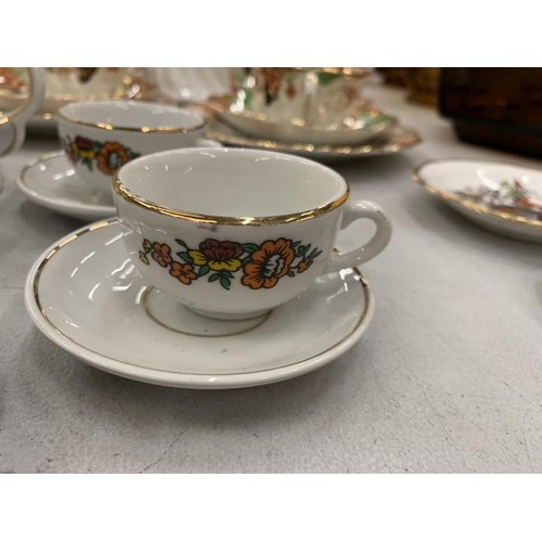 267 - A VINTAGE CHILD'S CERAMIC TEASET TO INCLUDE FOOUR CUPS AND SAUCERS, A TEAPOT AND A CREAM JUG