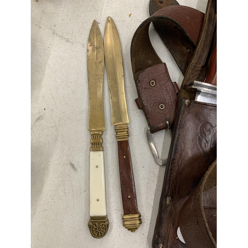 269 - A VINTAGE LEATHER SCABBARD AND DAGGER AND BRASS LETTER OPENERS