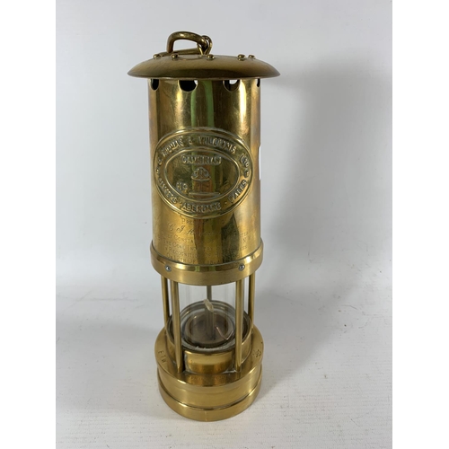 67 - * A BRASS PRESENTATION MINERS LAMP FROM THE COAL INDUSTRY SOCIETY (NW) 1981, HEIGHT 27CM AND A BOOK ... 