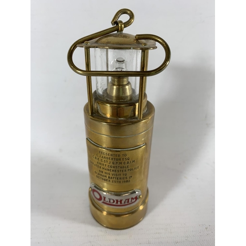 68 - * A BRASS PRESENTATION LAMP FROM ANDERTONS VISIT TO OLDHAM BATTERIES 1982, HEIGHT 12CM