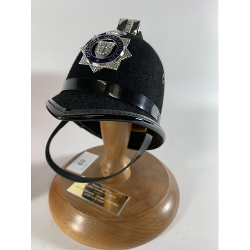 69 - * A PRESENTATION MINIATURE CHESHIRE CONSTABULARY HELMET BY CHRISTYS, MOUNTED ON A WOODEN STAND, PRES... 