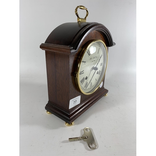 77 - * A PRESENTATION MANTLE CLOCK BY WM WIDDOP, HEIGHT 25CM, PRESENTED BY G.M.P A DIVISION 1991