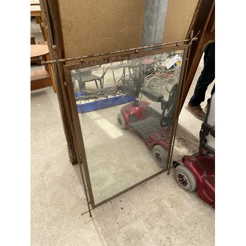 1986 - A METAL FRAMED WALL MIRROR