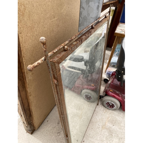 1986 - A METAL FRAMED WALL MIRROR