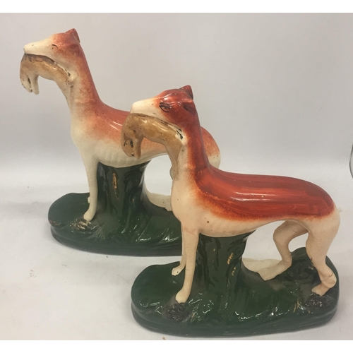 11 - A PAIR OF STAFFORDSHIRE HUNTING DOGS, HEIGHT 28CM