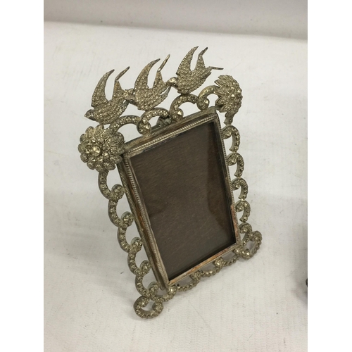 2 - A DECORATIVE HALLMARKED SILVER PHOTO FRAME WITH RIBBON DESIGN AND FURTHER METAL DOVE DESIGN PHOTO FR... 