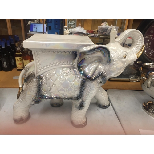 25 - A DECORATIVE CERAMIC GARDEN ELEPHANT SEAT WITH PEARLESCENT DESIGN AND GILT HIGHLIGHTS, HEIGHT 48CM