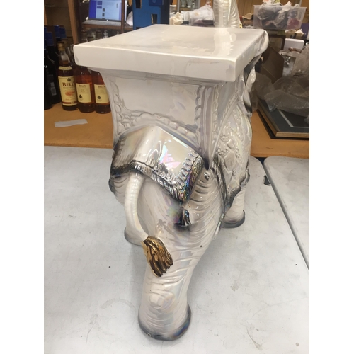 25 - A DECORATIVE CERAMIC GARDEN ELEPHANT SEAT WITH PEARLESCENT DESIGN AND GILT HIGHLIGHTS, HEIGHT 48CM