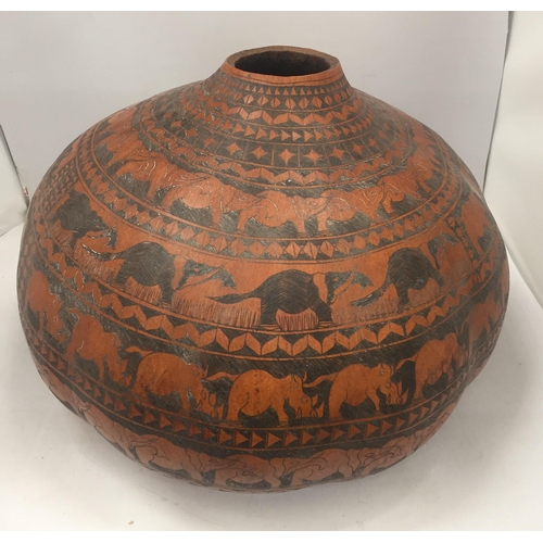 26 - AN AFRICAN CALABASH WATER CONTAINER, LENGTH 40CM