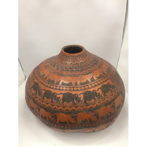 26 - AN AFRICAN CALABASH WATER CONTAINER, LENGTH 40CM