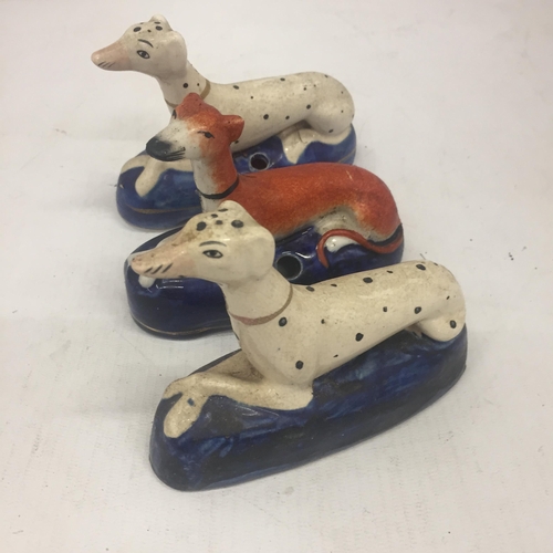 6 - A PAIR OF STAFFORDSHIRE DALMATION INKWELLS AND FURTHER GREYHOUND EXAMPLE