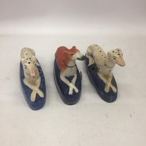 6 - A PAIR OF STAFFORDSHIRE DALMATION INKWELLS AND FURTHER GREYHOUND EXAMPLE