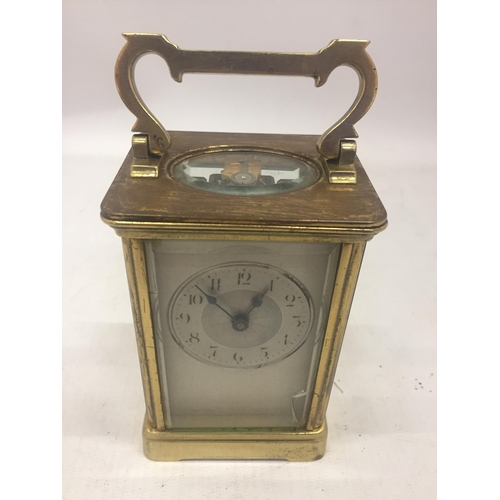 9 - A FRENCH ANTIQUE BRASS CASED CARRIAGE CLOCK WITH KEY