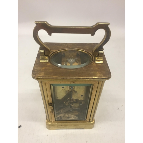 9 - A FRENCH ANTIQUE BRASS CASED CARRIAGE CLOCK WITH KEY