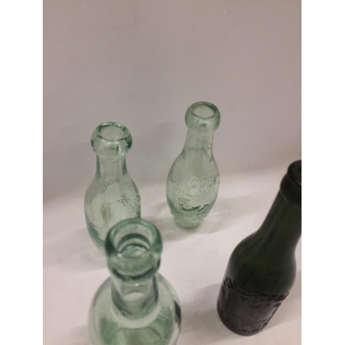 115 - FOUR VINTAGE GLASS BOTTLES