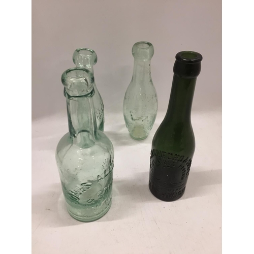 115 - FOUR VINTAGE GLASS BOTTLES