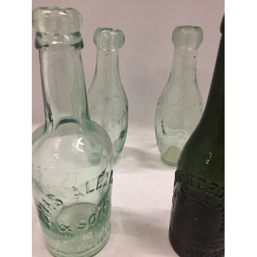 115 - FOUR VINTAGE GLASS BOTTLES