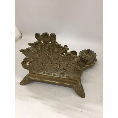 121 - A VINTAGE BRASS DESK SET INCLUDING INKWELLS AND A LETTER RACK