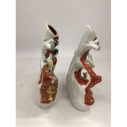 128 - A PAIR OF VINTAGE STAFFORDSHIRE STYLE SPILL HOLDERS WITH FIGURE AND FAUNA DECORATION HEIGHT 17.5CM