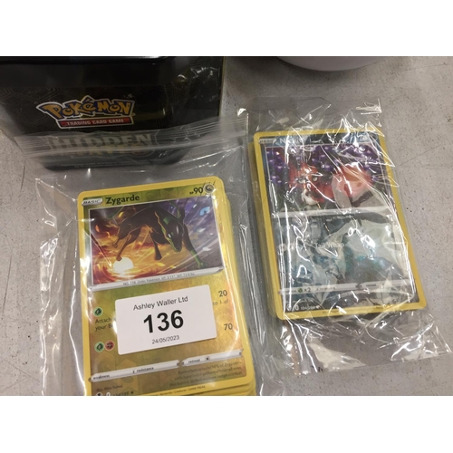 136 - TWO POKEMON TINS WITH 100+ CARDS TO INCLUDE HOLO'S, RARES, ETC