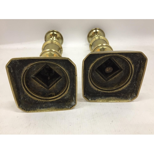 140 - A PAIR OF BRASS CANDLESTICKS HEIGHT 26.5CM