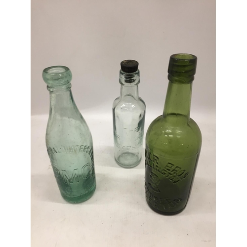 146 - THREE VINTAGE GLASS ADVERTISING BOTTLES