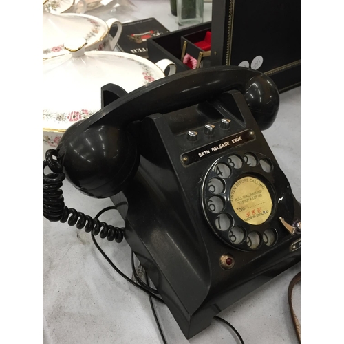 171 - A VINTAGE BLACK BAKELITE ROTARY DIAL TELEPHONE