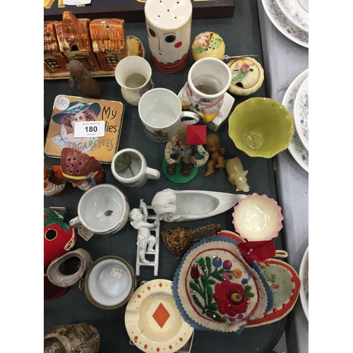 180 - A MIXED LOT TO INCLUDE A CARLTON WARE 'FACE' PEPPER POT, SMALL CUPS AND MUGS, METAL FIGURES, A VINTA... 