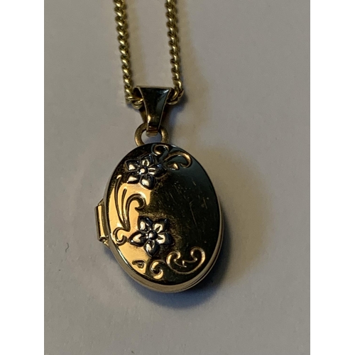 467 - A 9 CARAT GOLD NECKLACE WITH OVAL LOCKET GROSS WEIGHT 3.0 GRAMS