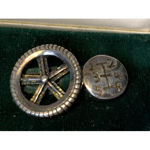 486 - A PAIR OF SILVER MOTORING GEAR CUFFLINKS IN A PRESENTATION BOX