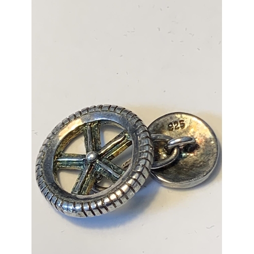 486 - A PAIR OF SILVER MOTORING GEAR CUFFLINKS IN A PRESENTATION BOX