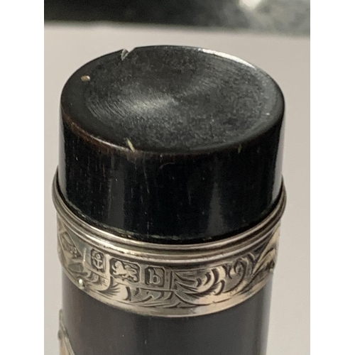 494 - AN EBONY POT WITH HALLMARKED BIRMINGHAM 1901 SILVER MOUNTS 10 CM TALL