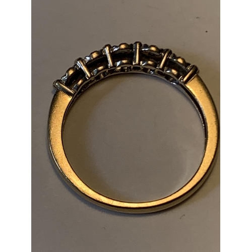 503 - A 9 CARAT GOLD RING WITH FIVE IN LINE DIAMONDS SIZE M